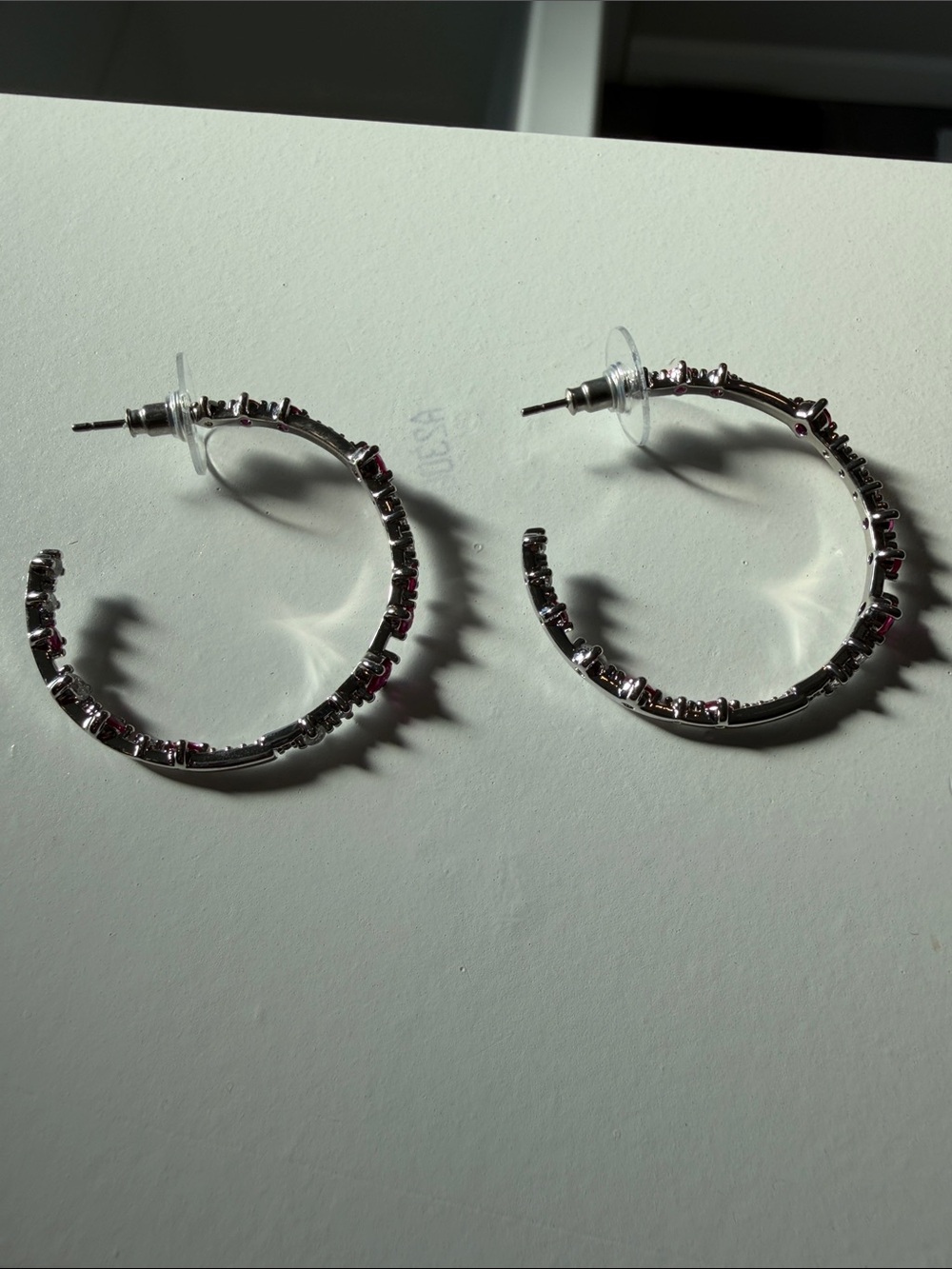 Silver Hoop Earrings with Pink Gem Accents